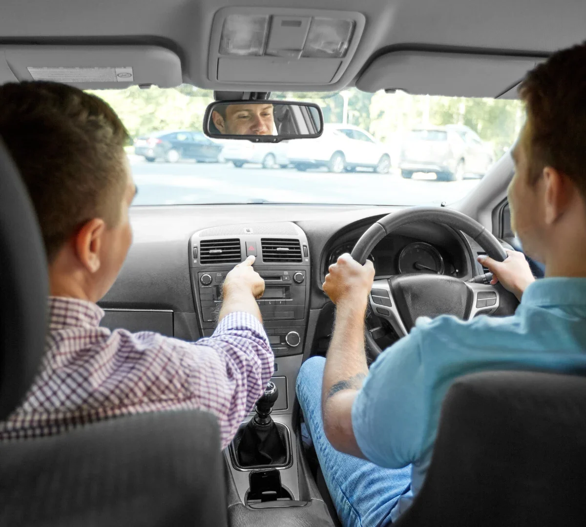 Two people in car during driving lesson