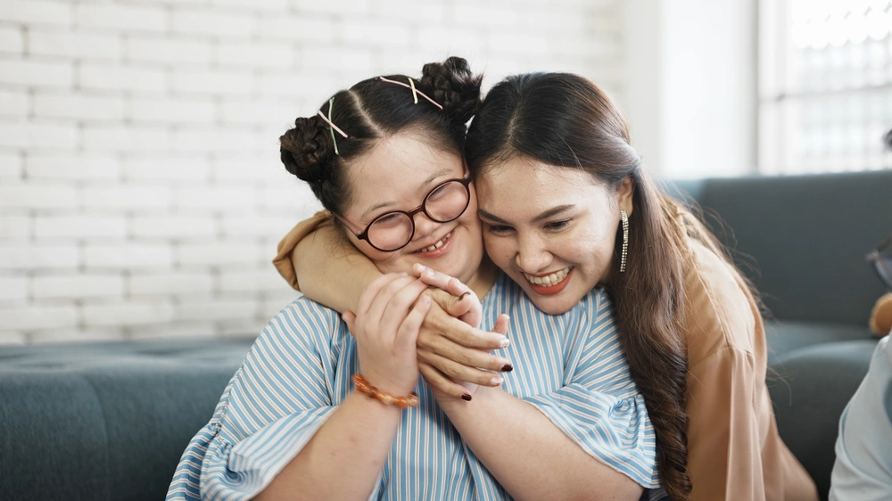 Disabled girl smiling with disabled girl